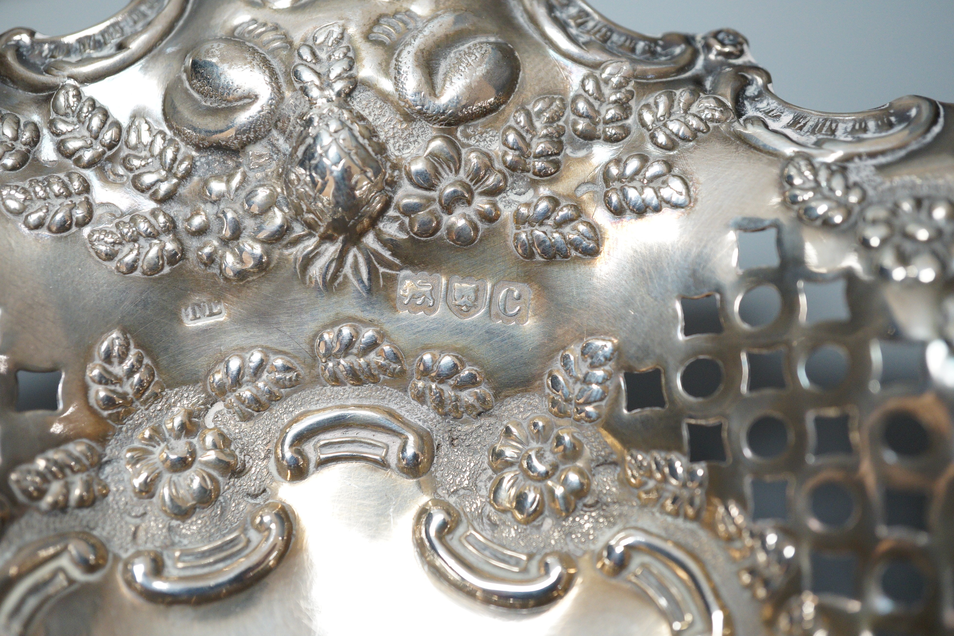 A late Victorian pierced silver pedestal bon bon dish, London, 1898, a silver mounted specimen vase and two silver backed brushes